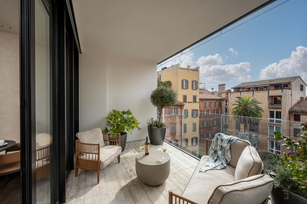 Private terrace of the One-Bedroom Apartment with Big Terrace at master Trevi Rome aparthotel, offering outdoor seating and city views