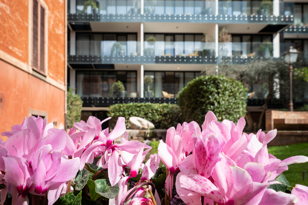 Facade of Master Trevi Rome Aparthotel with elegant balconies overlooking the historic streets of Rome.