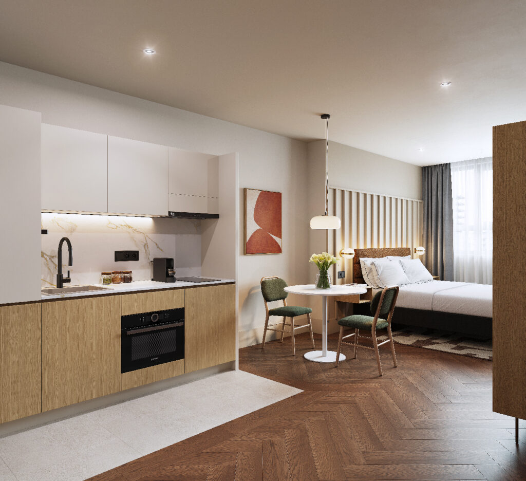 Modern studio apartment with fully equipped kitchenette, dining table, and double bed in master Wola Warsaw.